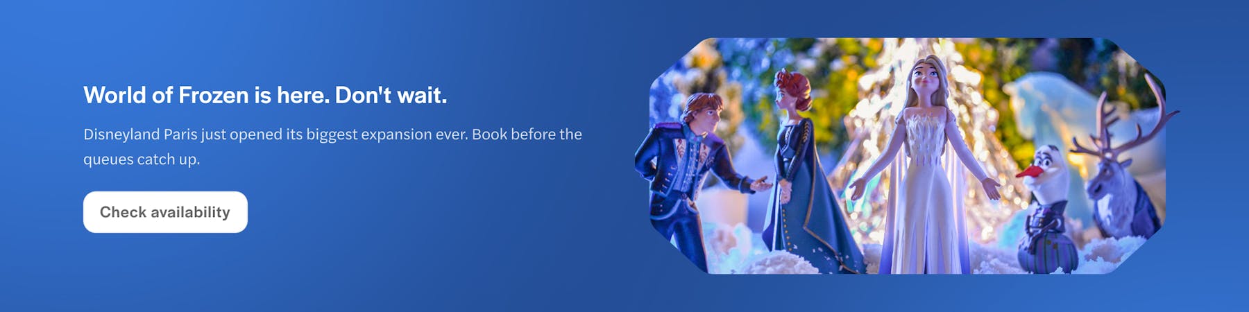 Disneyland Paris Frozen characters in snowy scene.